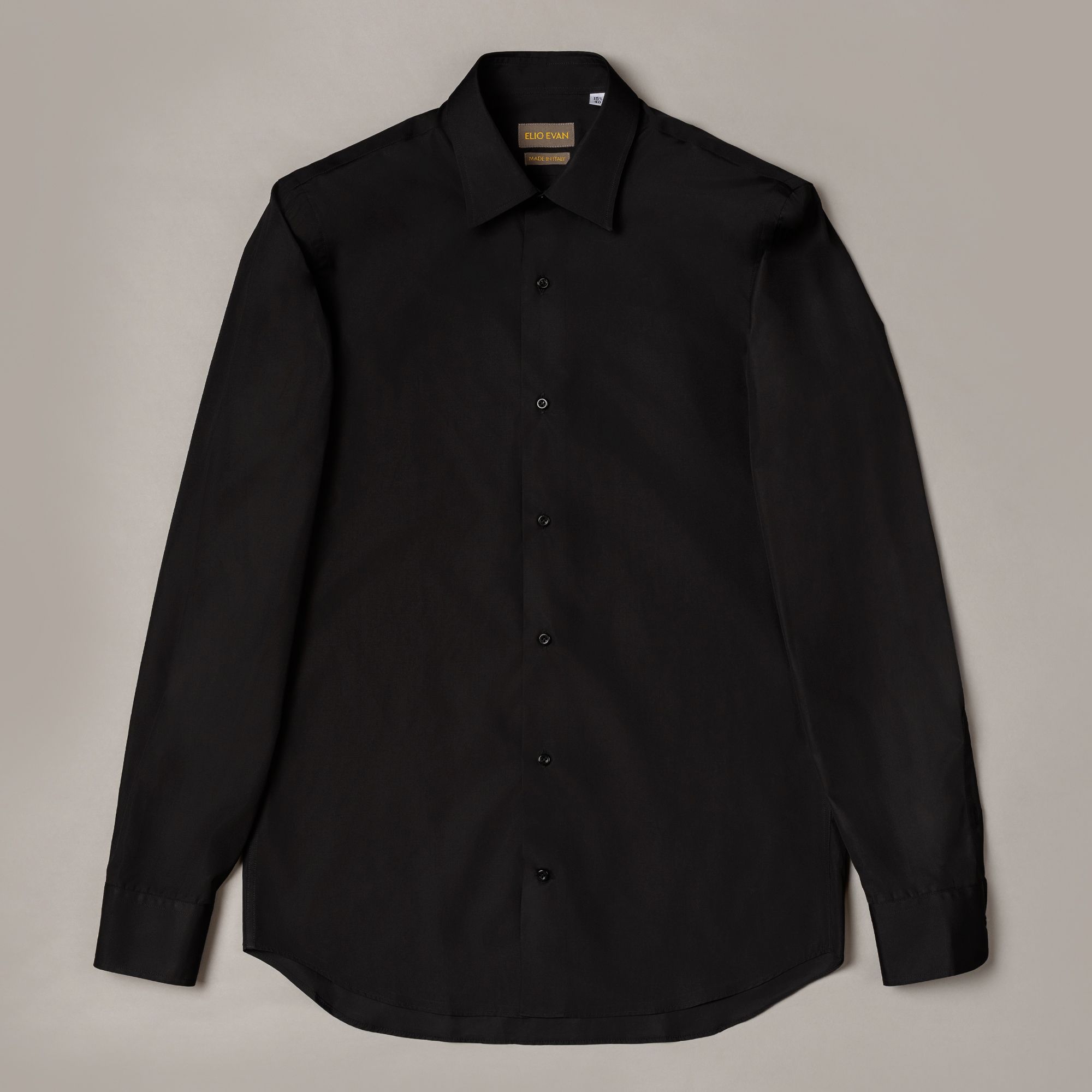 Slim black cotton shirt with a smooth poplin feel and formal line. Precise premium menswear with Italian craft by Elio E