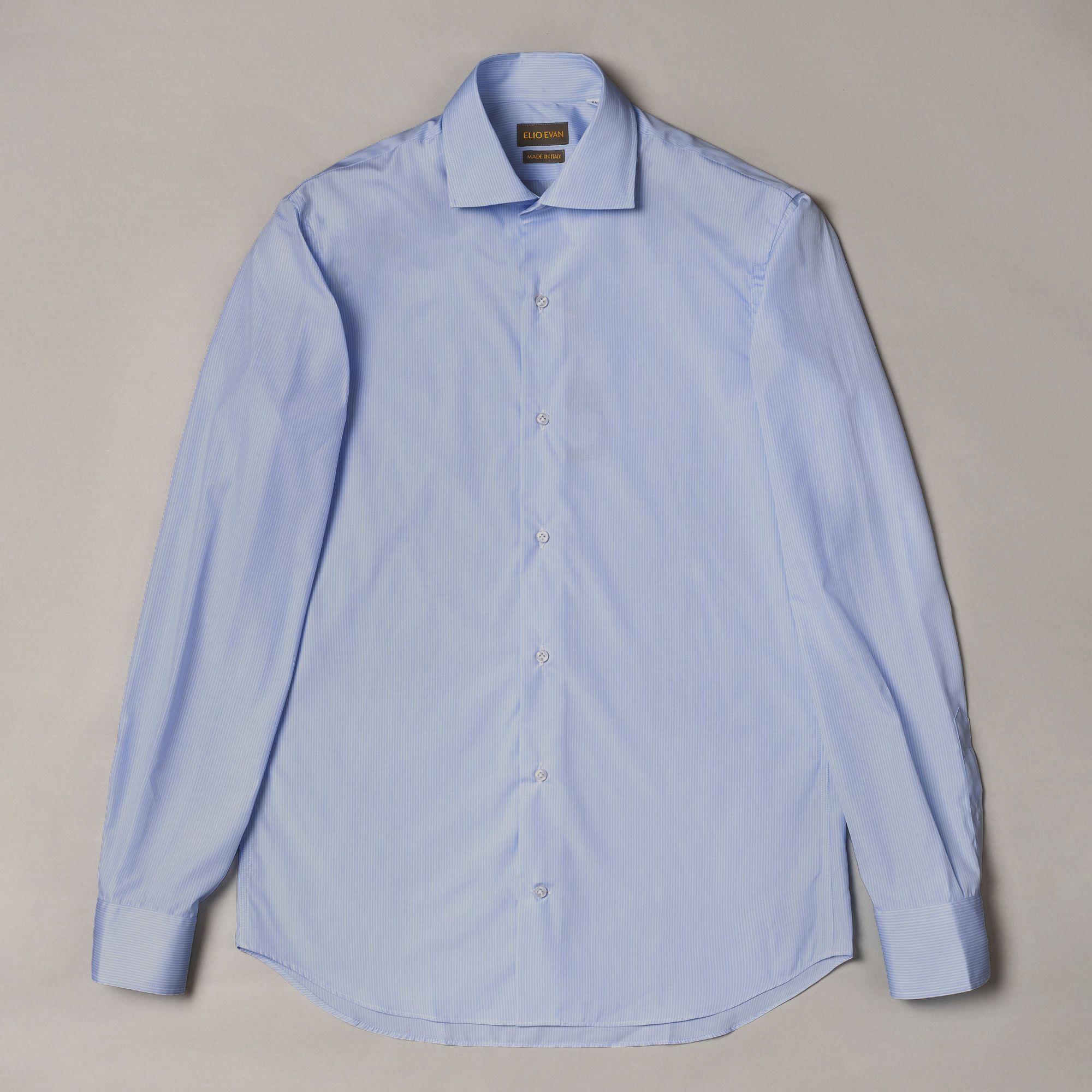 Slim fit Sky Blue cotton shirt with tonal stripe and crisp poplin feel. Precise formal menswear by Elio Evan.