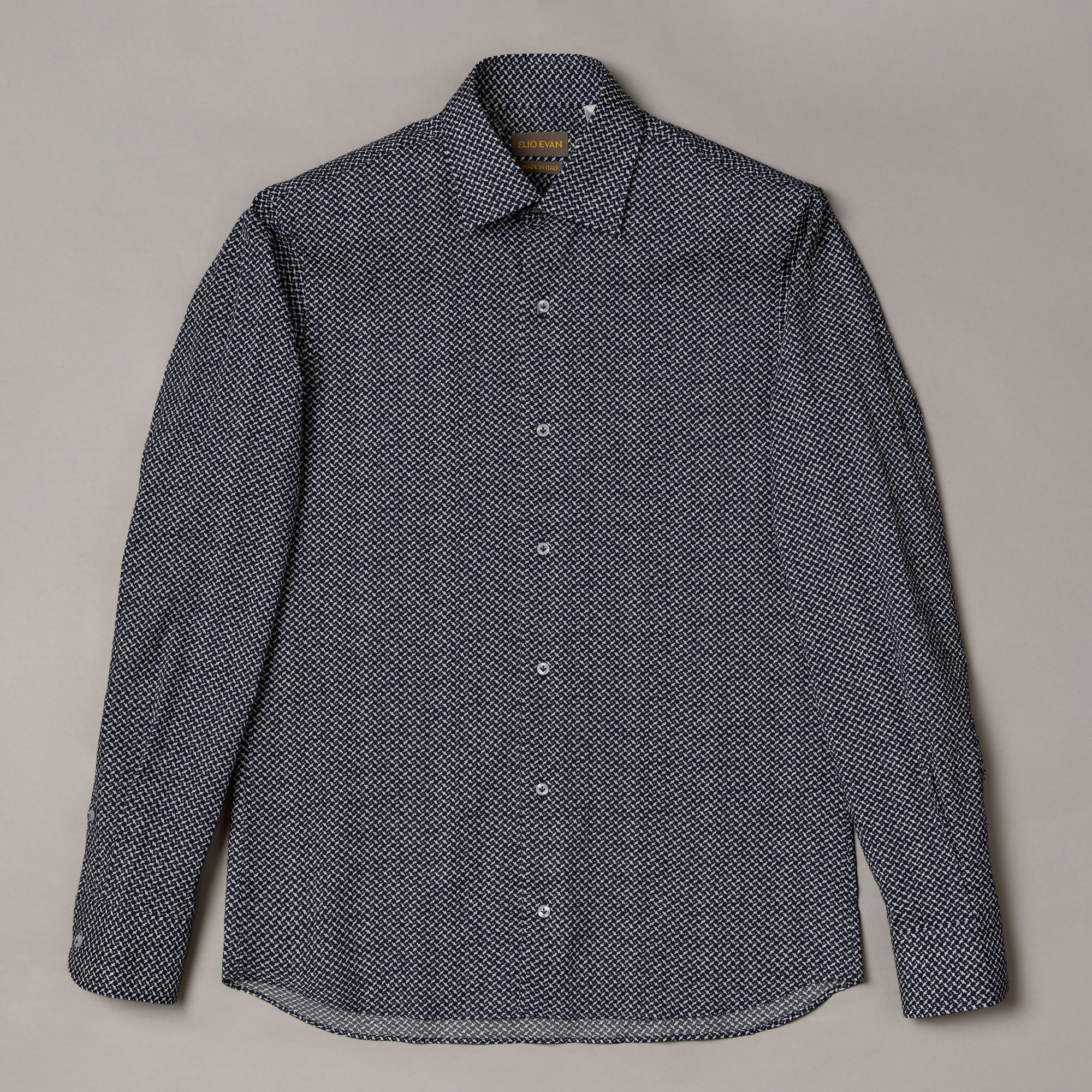 Slim blue cotton shirt with herringbone texture and brushed finish. Precise smart-casual premium menswear by Elio Evan.
