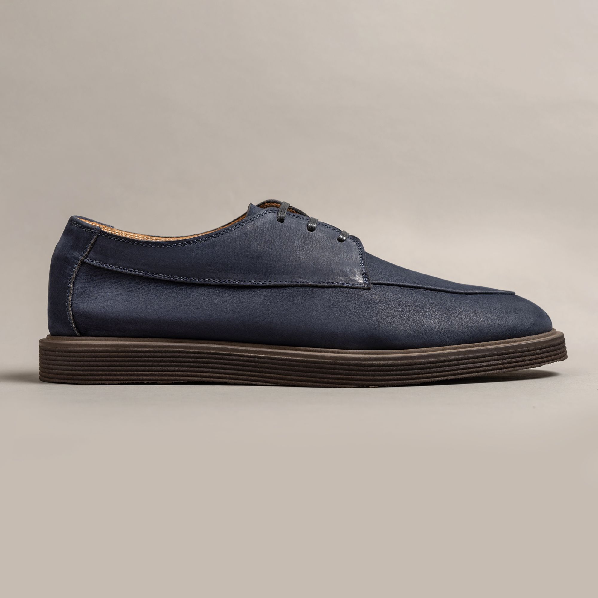 Blue genuine leather derby shoes with a slim profile and brushed finish. Structured premium menswear with Italian craft